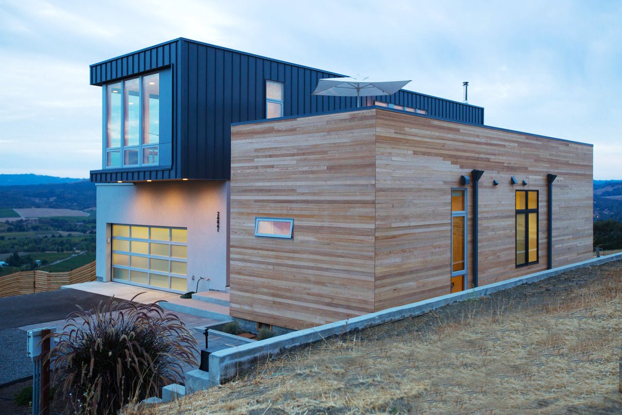 Image of a modern modular home design in the evening